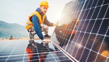 Workers assemble energy system with solar panel for electricity _ Premium Photo